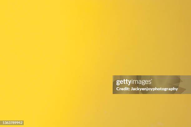 bright mustard yellow color background - sfondo giallo foto e immagini stock