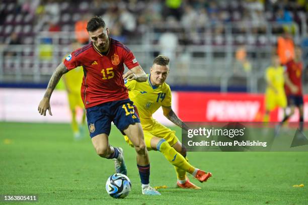 Midfielder Oleksandr Nazarenko of Ukraine and defender Mario Gila of Spain are seen in action during the 2023 UEFA European Under-21 Championship...