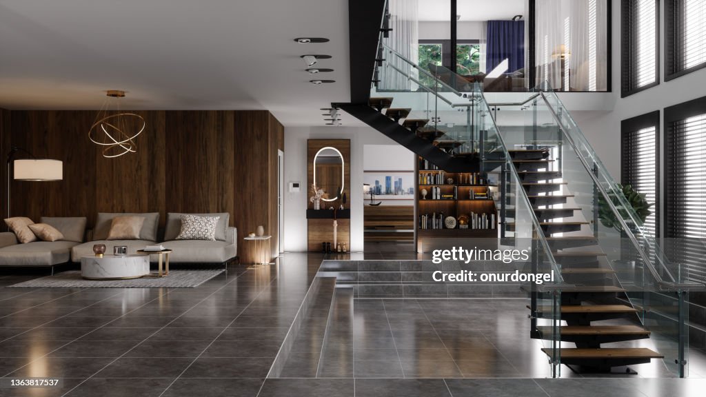 Luxury Modern House Interior With Corner Sofa, Bookshelf And Staircase