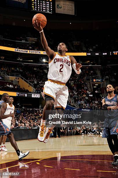Kyrie Irving of the Cleveland Cavaliers goes to the basket during the second quarter against the Charlotte Bobcats at The Quicken Loans Arena on...