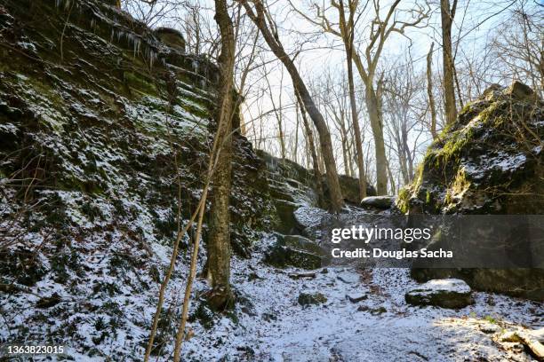 sedimentary rock cliff in the winter season - steep hill stock pictures, royalty-free photos & images