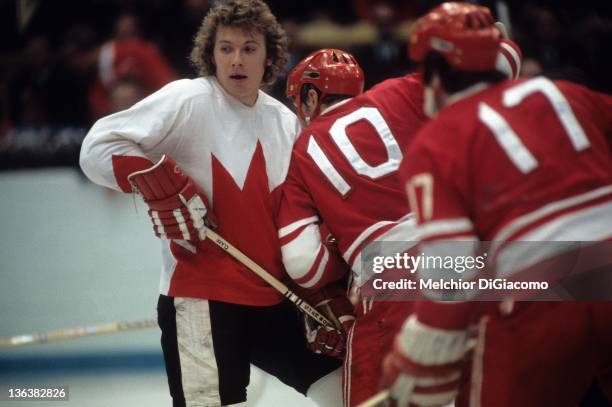 Bobby Clarke of Canada is checked by Aleksandr Maltsev of the Soviet Union during the 1972 Summit Series at the Luzhniki Ice Palace in Moscow, Russia.