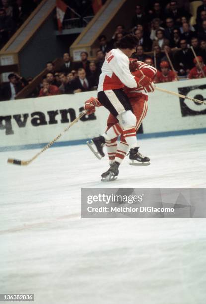Bobby Clarke of Canada checks Alexander Volchkov of the Soviet Union during the 1972 Summit Series at the Luzhniki Ice Palace in Moscow, Russia.