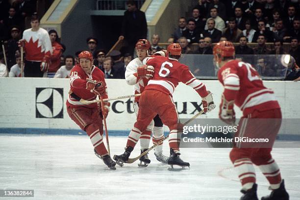 Paul Henderson of Canada is checked by Vladimir Shadrin and Valeri Vasiliev of the Soviet Union during the 1972 Summit Series at the Luzhniki Ice...