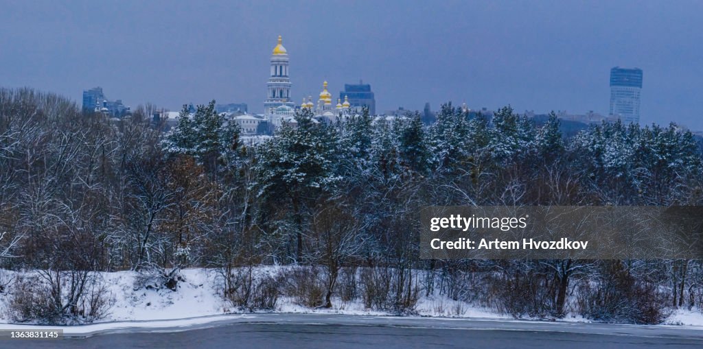 Winter panorama of Kyiv-Pechersk Lavra. Standing on hills of Kyiv,