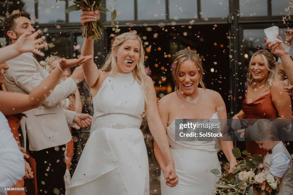 Throwing Confetti at the Brides