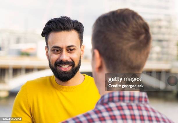 two friends talking in london - facial hair stock pictures, royalty-free photos & images