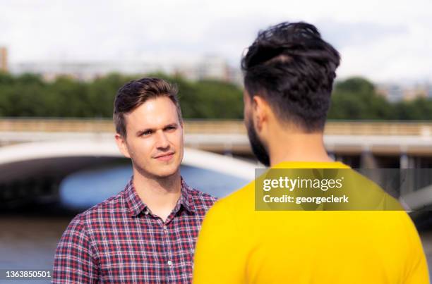 talking to each other - gay couple in love stock pictures, royalty-free photos & images