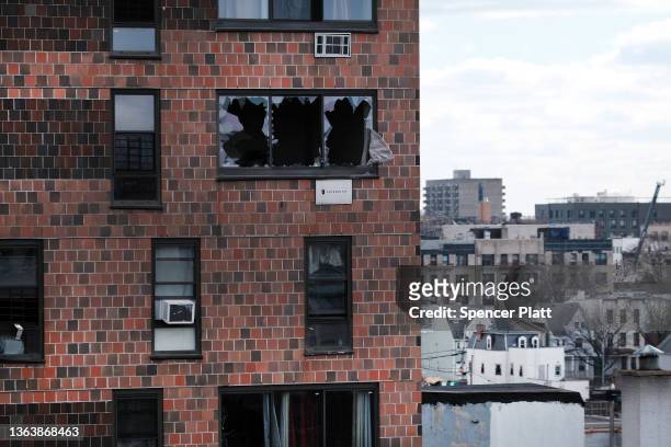 The Bronx apartment building stands a day after a fire swept through the complex killing at least 17 people and injuring dozens of others, many of...