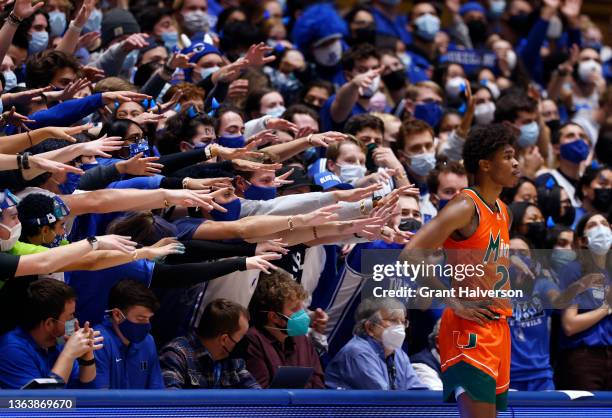 The Cameron Crazies taunt Kameron McGusty of the Miami Hurricanes as he waits to inbound the ball during the second half of their game against the...