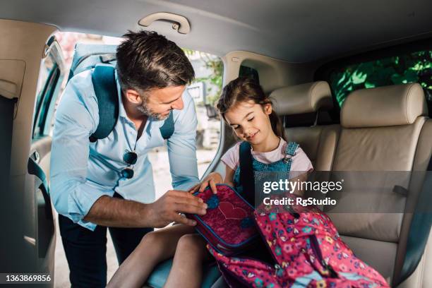 father prepares the girl for school - family car studio stock pictures, royalty-free photos & images