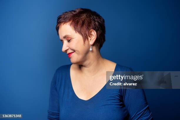 happy mature woman portrait with eyes closed - real people serious not looking at camera not skiny stock pictures, royalty-free photos & images