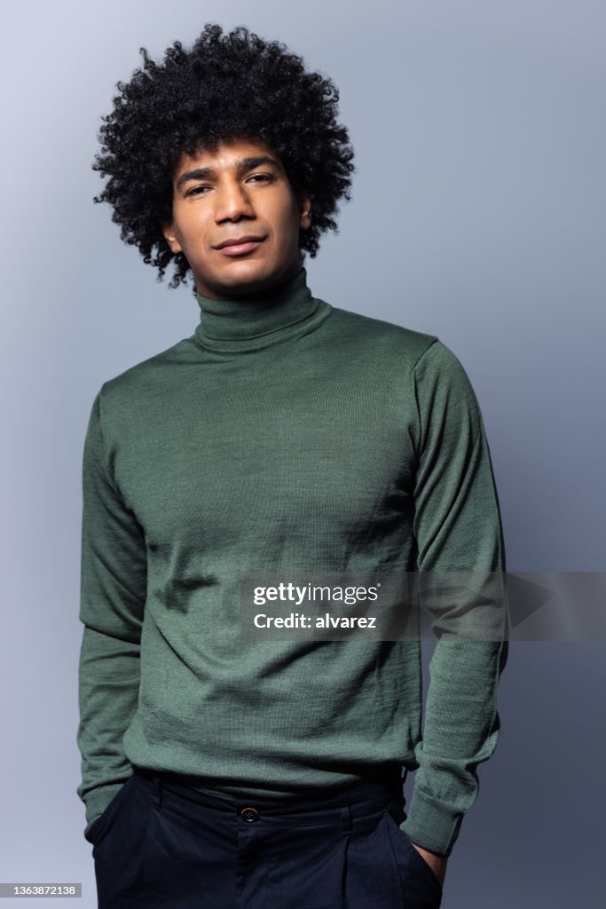 Studio portrait of a stylish north african man with afro hairstyle