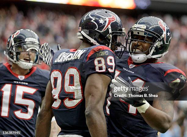 Wide receiver Bryant Johnson of the Houston Texans cellibrates with teammates Jeff Maehl and Ben Tate after Johnson's touchdown reception late in the...