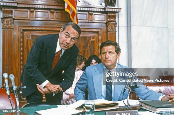 Senators Bob Dole and Special Senate Judiciary Subcommittee Chairman Birch Bayh talk together during a hearing, Washington DC, August 21, 1980. The...