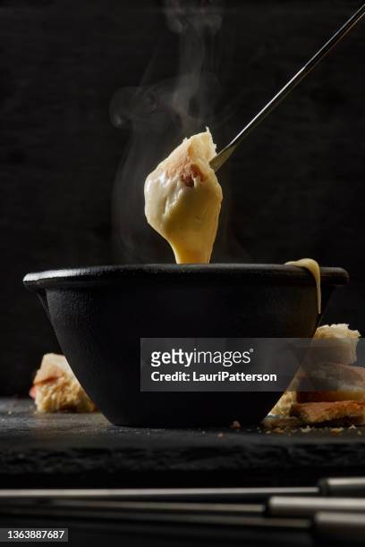 cheese fondue with french bread - cheese fondue stock pictures, royalty-free photos & images