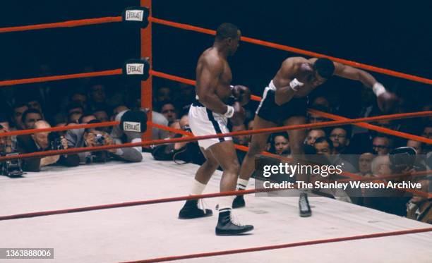 Sequence Photo 2- Photo shows Sonny Liston and Floyd Patterson in action early in the first round during their Heavyweight Title bout at Comiskey...