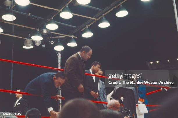 Photo shows Gene Fullmer, Rocky Marciano, Muhammad Ali , and Joe Louis in the boxing Ring prior to the start of the Heavyweight Title bout, Sonny...