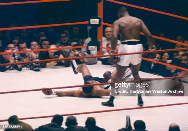 Sequence Photo 3- Photo shows Floyd Patterson on the canvas and Sonny Liston standing over Patterson during their Heavyweight Title bout at Comiskey...