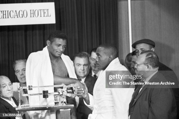 Photo shows Floyd Patterson and Sonny Liston shaking hands at the Sheraton Hotel in Chicago after both fighters have weighed-in prior to their...