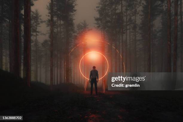 inert zombie standing in the forest at night - scary stock pictures, royalty-free photos & images