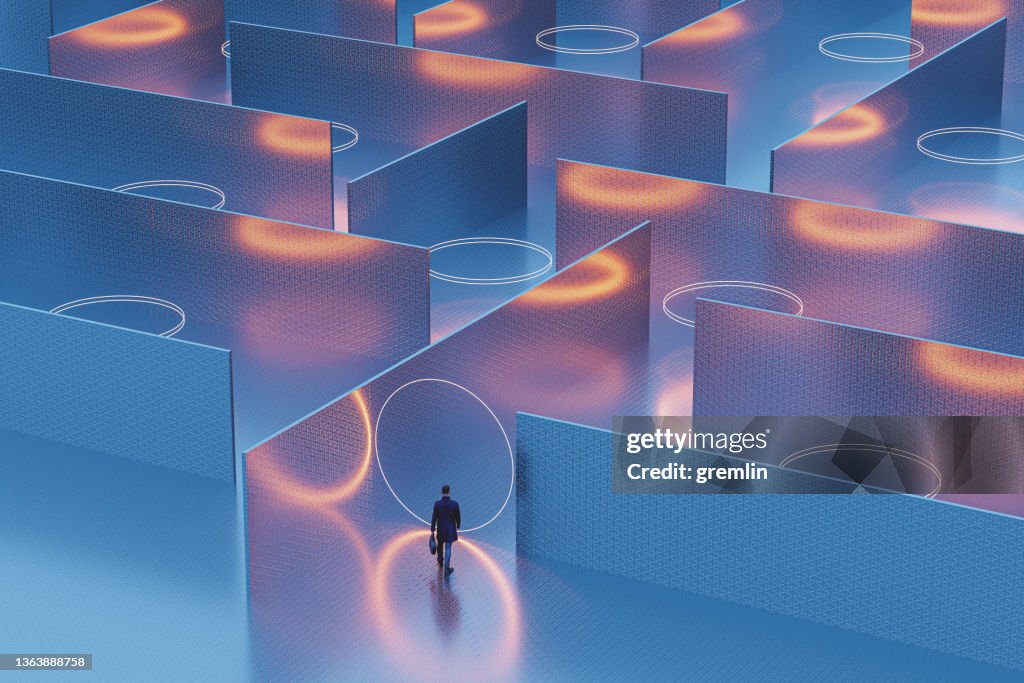 Businessman walking into mysterious maze