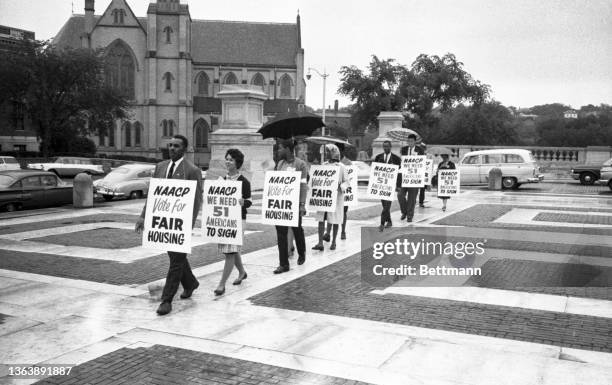 Members of the Providence Branch of the NAACP picket the Rhode Island State House in support of fair housing legislation. The NAACP is urging passage...