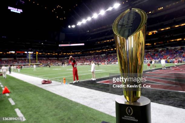 The National Championship Trophy is seen on the field prior to the 2022 CFP National Championship Game between the Alabama Crimson Tide and Georgia...