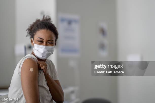 getting vaccinated - booster dose stock pictures, royalty-free photos & images