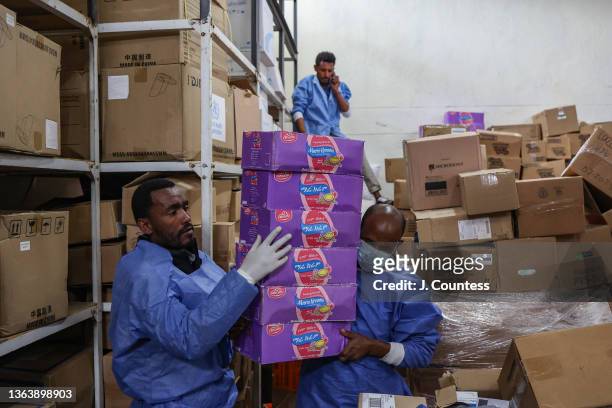 Pharmacy workers organize new shipments of medicines and supplies that replaced items looted from the Dessie Referral Hospital during the 2021 TPLF...