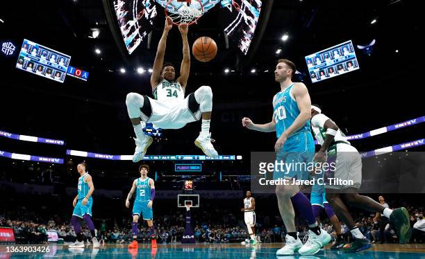 Giannis Antetokounmpo of the Milwaukee Bucks dunks the ball during the first half of the game against the Charlotte Hornets at Spectrum Center on...