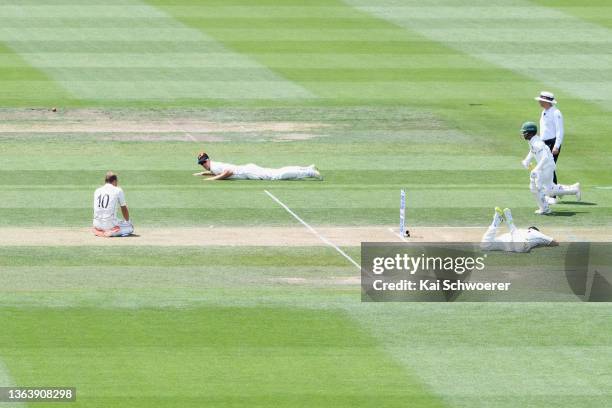 Neil Wagner, Kyle Jamieson and Daryl Mitchell of New Zealand reacduring day three of the Second Test match in the series between New Zealand and...