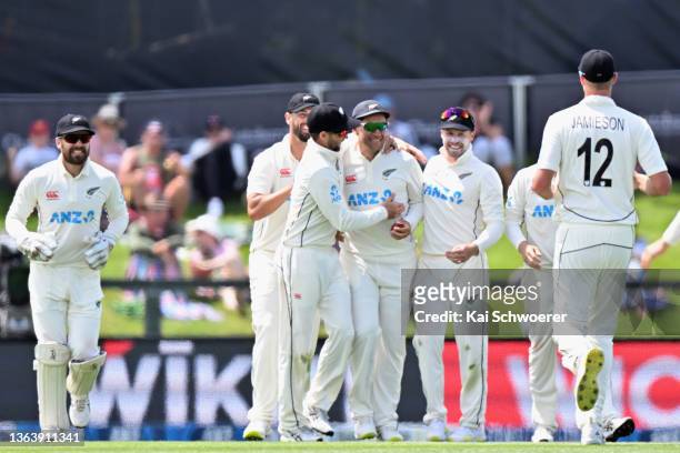 Ross Taylor of New Zealand is congratulated by team mates after taking a catch to dismiss Mominul Haque of Bangladesh during day three of the Second...