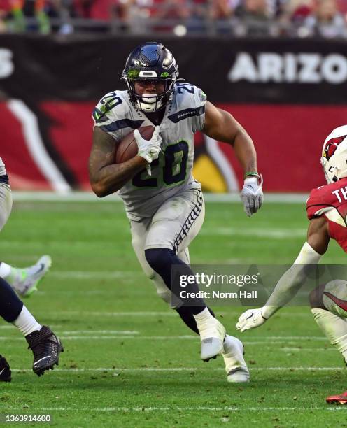 Rashaad Penny of the Seattle Seahawks runs with the ball against the Arizona Cardinals at State Farm Stadium on January 09, 2022 in Glendale, Arizona.