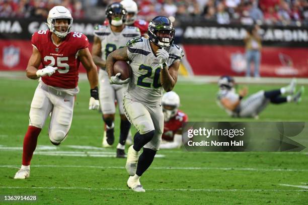 Rashaad Penny of the Seattle Seahawks runs with the ball against the Arizona Cardinals at State Farm Stadium on January 09, 2022 in Glendale, Arizona.