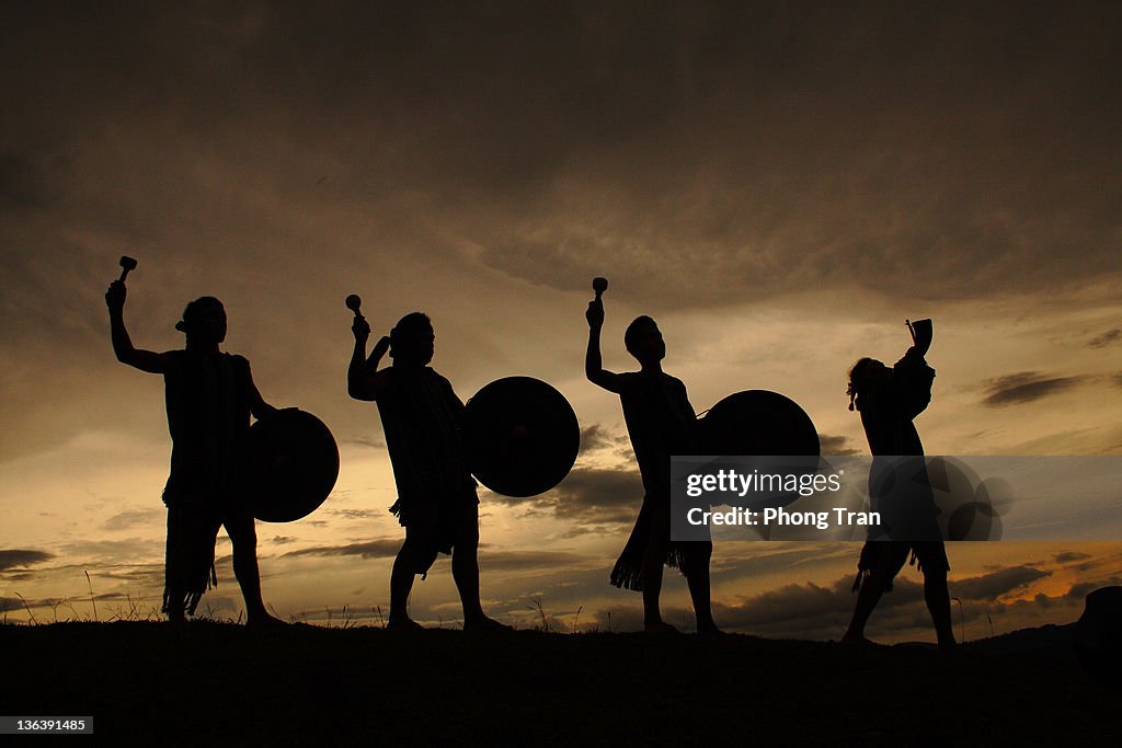 Four people playing drums