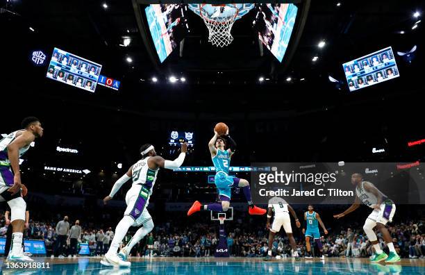 LaMelo Ball of the Charlotte Hornets shoots the go-ahead basket in the final seconds of the fourth quarter of the game against the Milwaukee Bucks at...