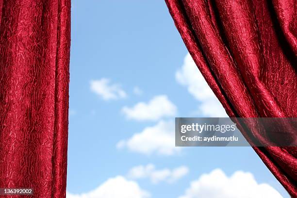 red curtains and cloudy sky - open sky stockfoto's en -beelden