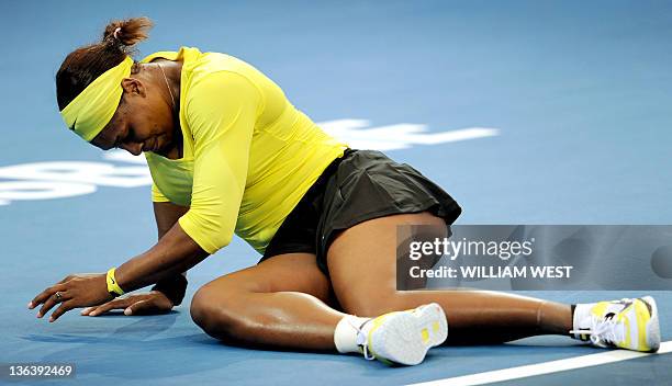 Serena Williams of the US lies on the court after injuring her ankle during her second round women's singles match against Bojana Jovanovski of...