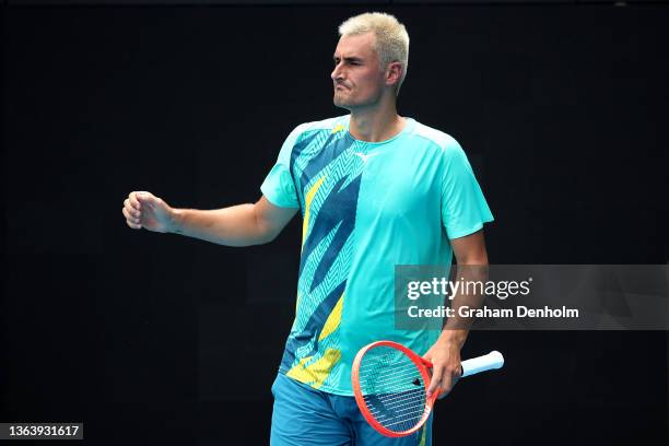 Bernard Tomic of Australia reacts in his match against Roman Safiullin of Russia during day two of 2022 Australian Open Qualifying at Melbourne Park...