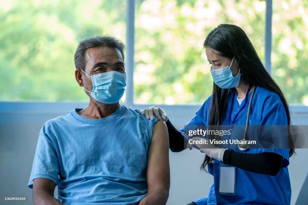 People Injection Doctor Giving Injection On Hips