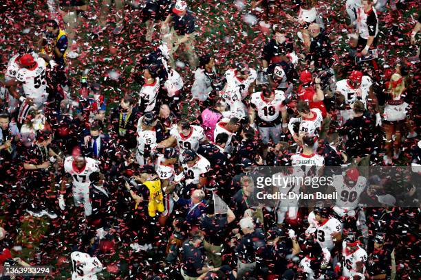Georgia Bulldogs players celebrate after defeating the Alabama Crimson Tide 33-18 in the 2022 CFP National Championship Game at Lucas Oil Stadium on...