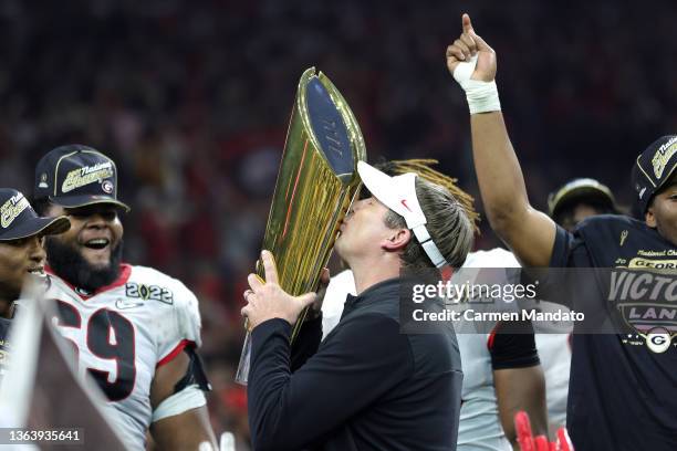 Head Coach Kirby Smart of the Georgia Bulldogs celebrates with the National Championship trophy after the Georgia Bulldogs defeated the Alabama...