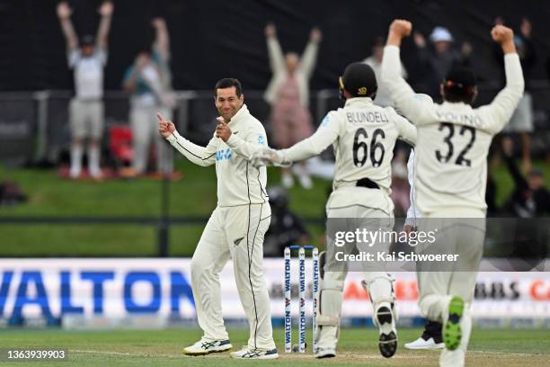 Ross Taylor of New Zealand is congratulated by team mates after dismissing Ebadot Hossain Chowdhury of Bangladesh during day three of the Second Test...