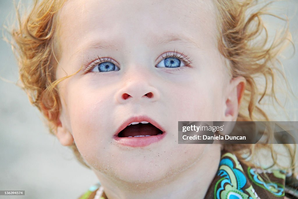 Girl with expression of wonder on her face