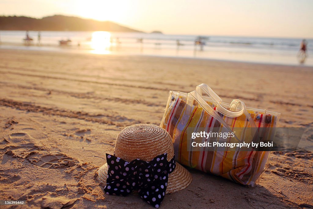 Hat and bag on beach