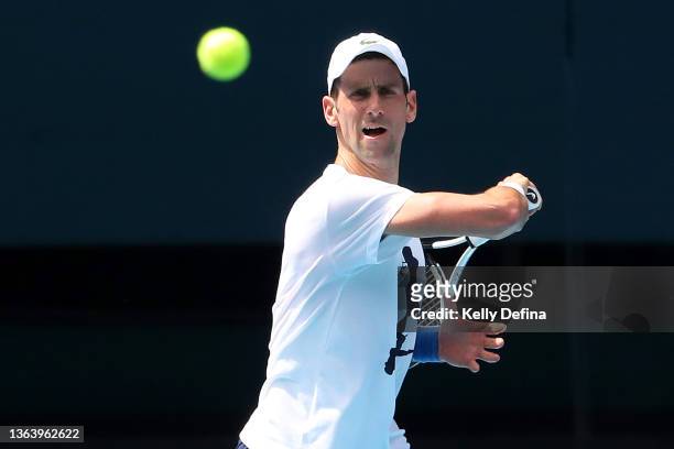 Novak Djokovic of Serbia practices on Rod Laver Arena ahead of the 2022 Australian Open at Melbourne Park on January 11, 2022 in Melbourne,...