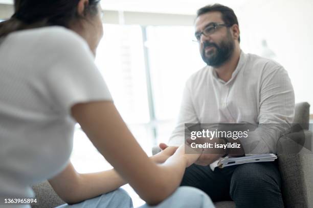 psychologist is listening to problems of a woman patient - suicide stock pictures, royalty-free photos & images