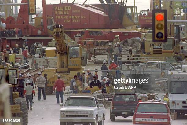 Rescue workers with cranes set up operations near the Federal Building in Oklahoma City 21 April to help in their search for survivors after the 19...