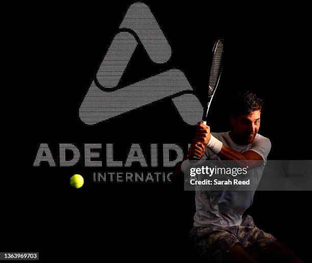 Thanasi Kokkinakis of Australia in action against Benoit Paire of France during day three of the 2022 Adelaide International at Memorial Drive on...